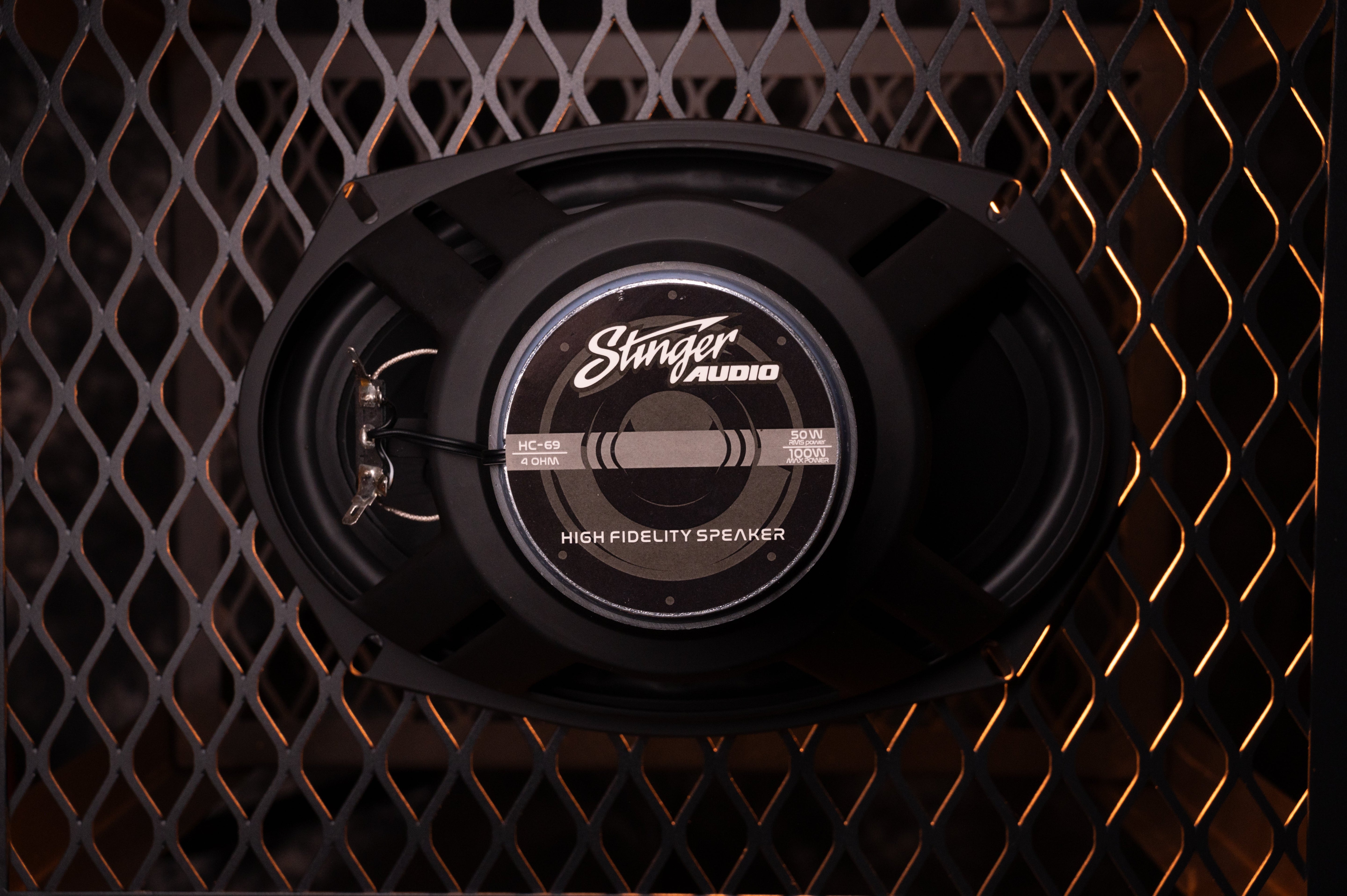 Hero image of the back of the speaker, reading "Stinger Audio, HC-69/4 OHM, 50 watt RMS power/100 watt Max power, High Fidelity Speaker"