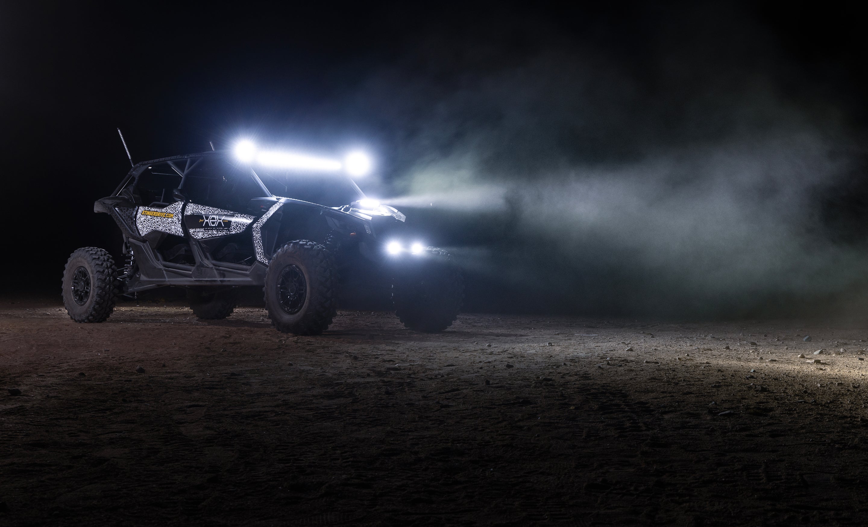 Off road vehicle with bright LED light bar illuminated in the dark