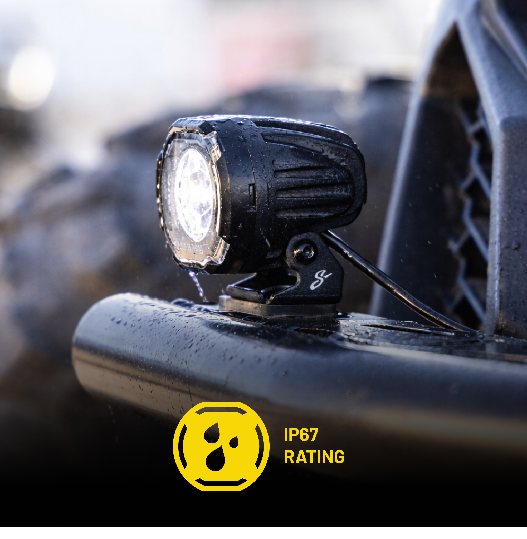 Black LED off road light mounted on vehicle bumper with IP67 rating icon