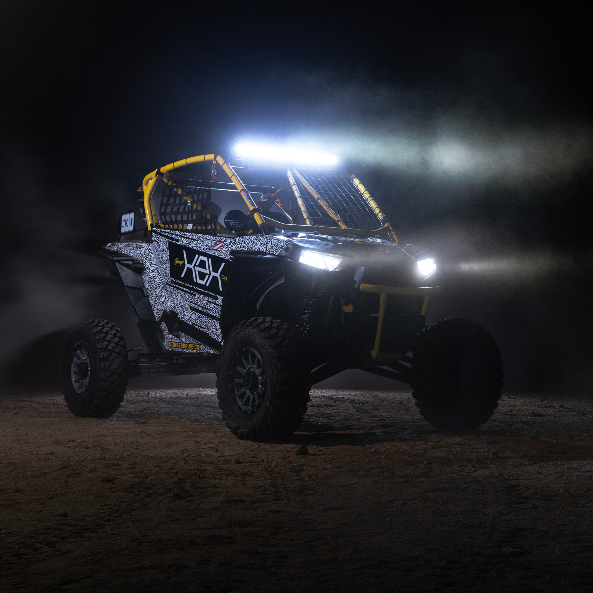 Off road vehicle with bright LED light bar on at night