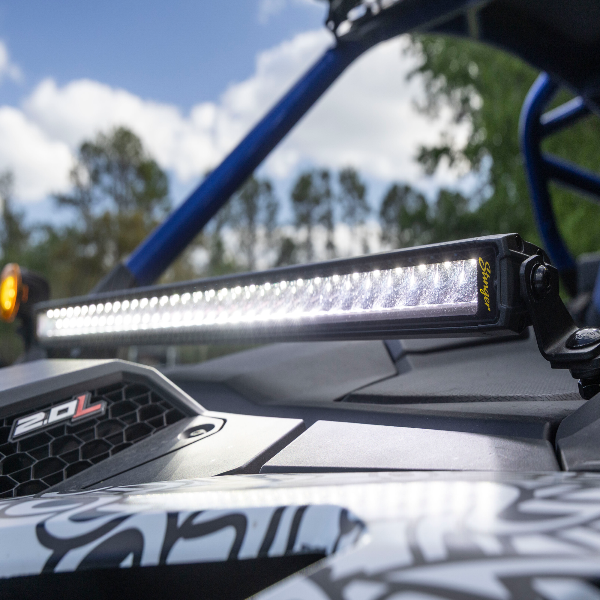 LED light bar on a vehicle with a blurred natural background