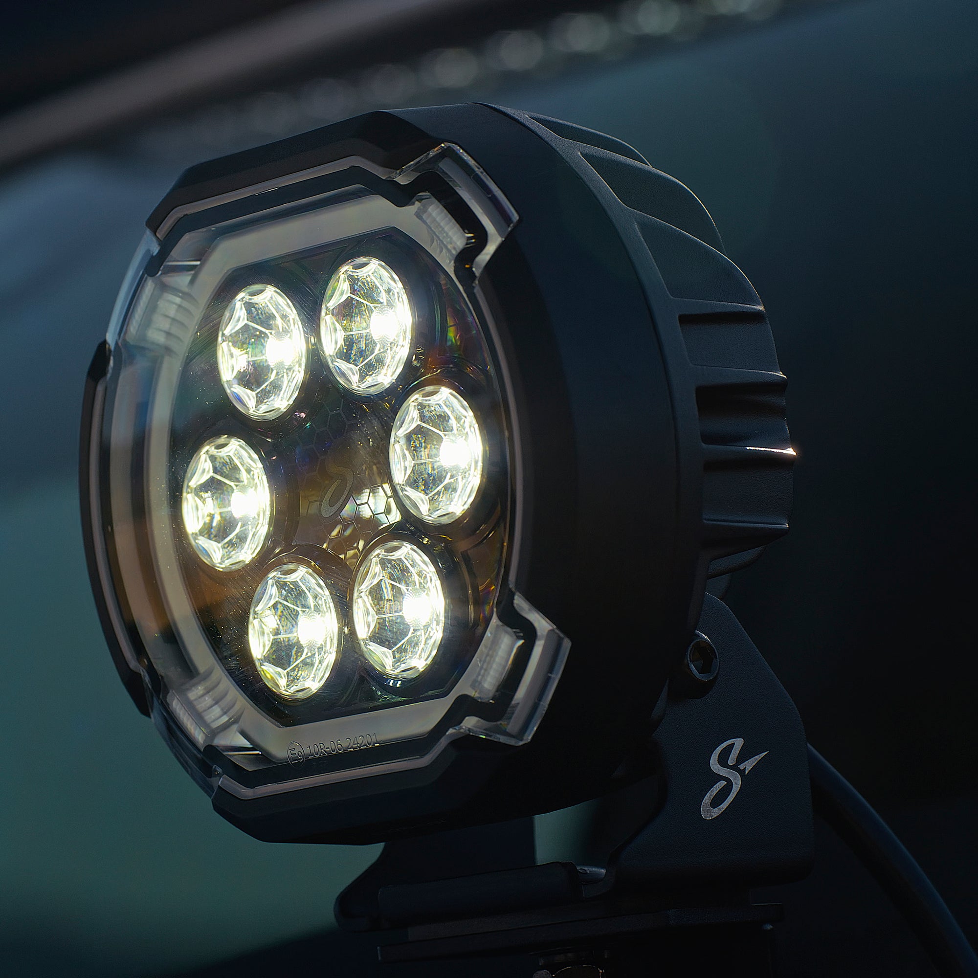 Round black LED off road driving light with six circular reflectors