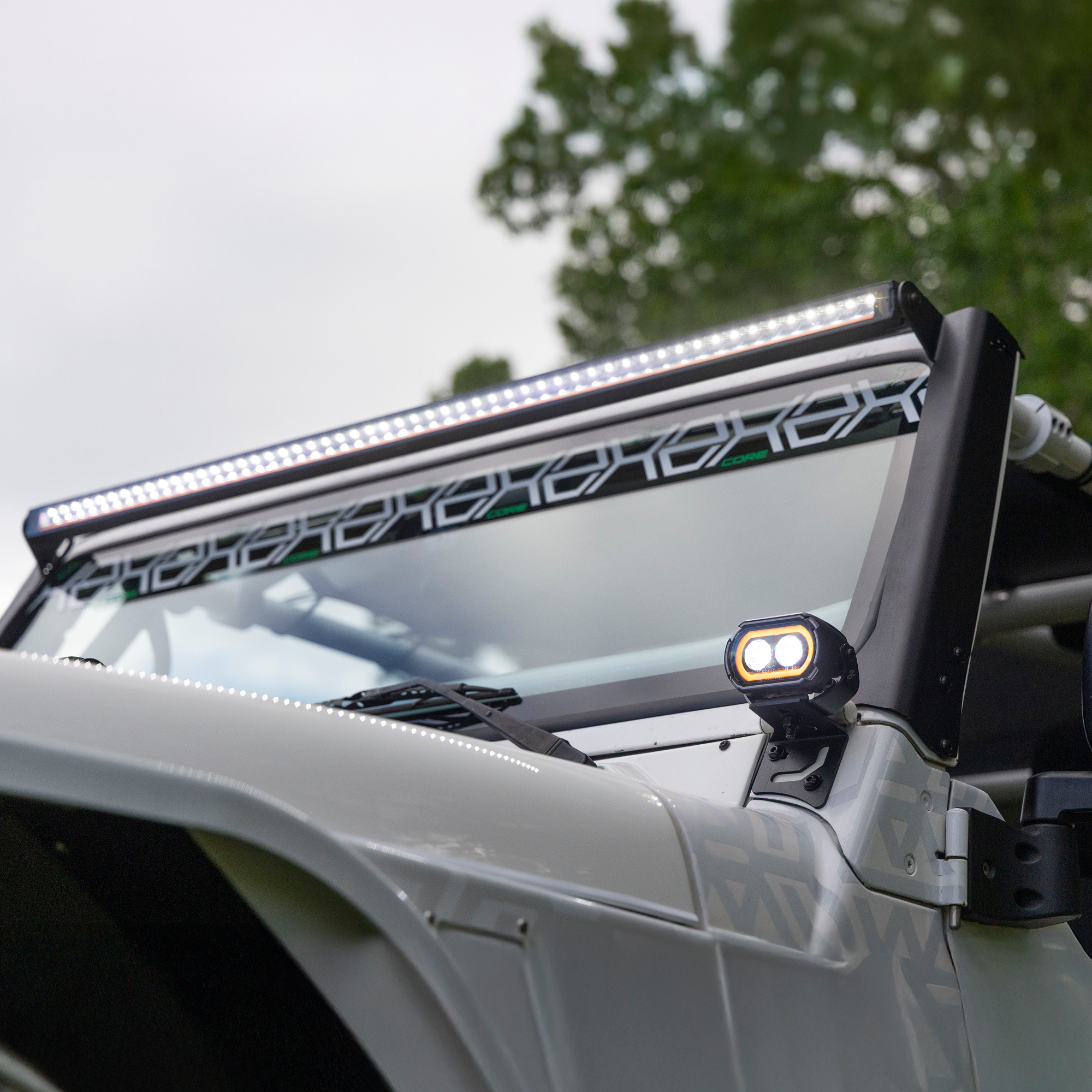 LED light bar on a vehicle with a blurred natural background