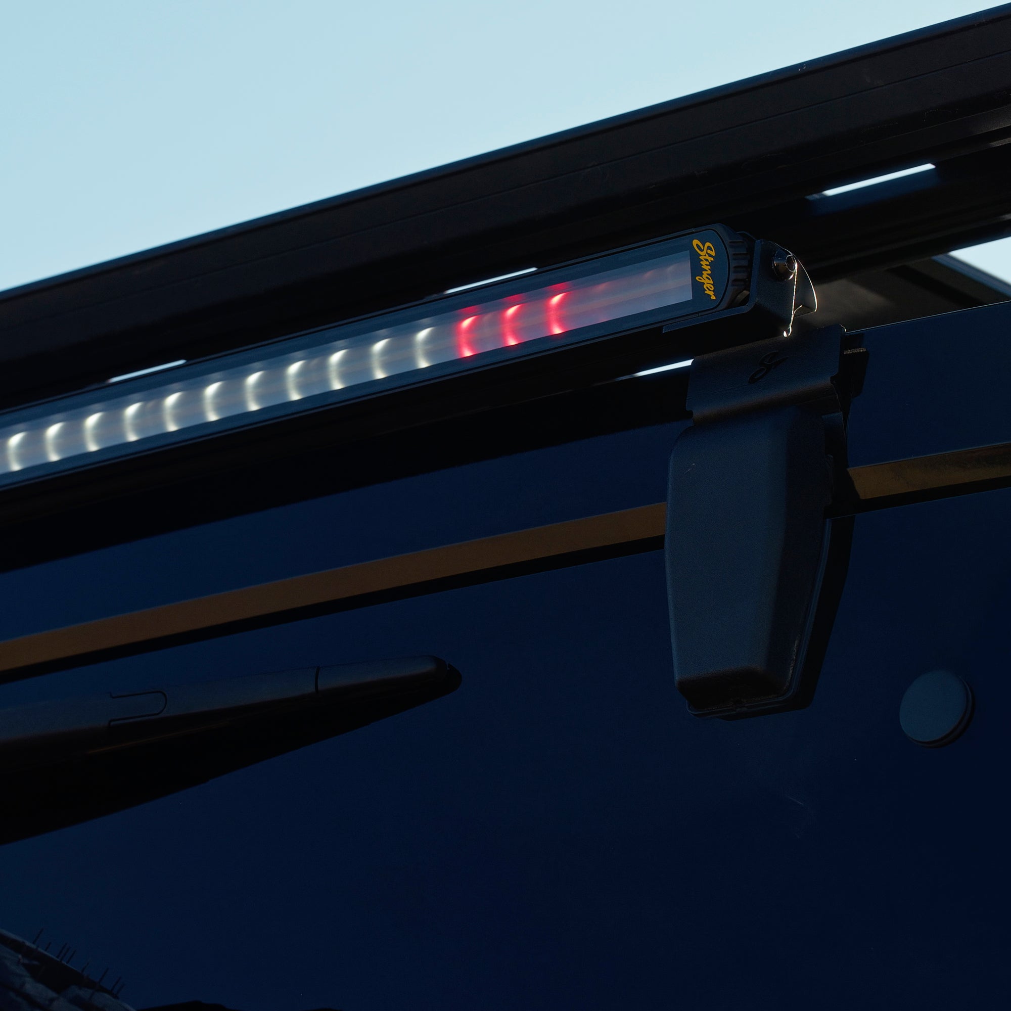 Stinger LED light bar mounted on a vehicle roof rack