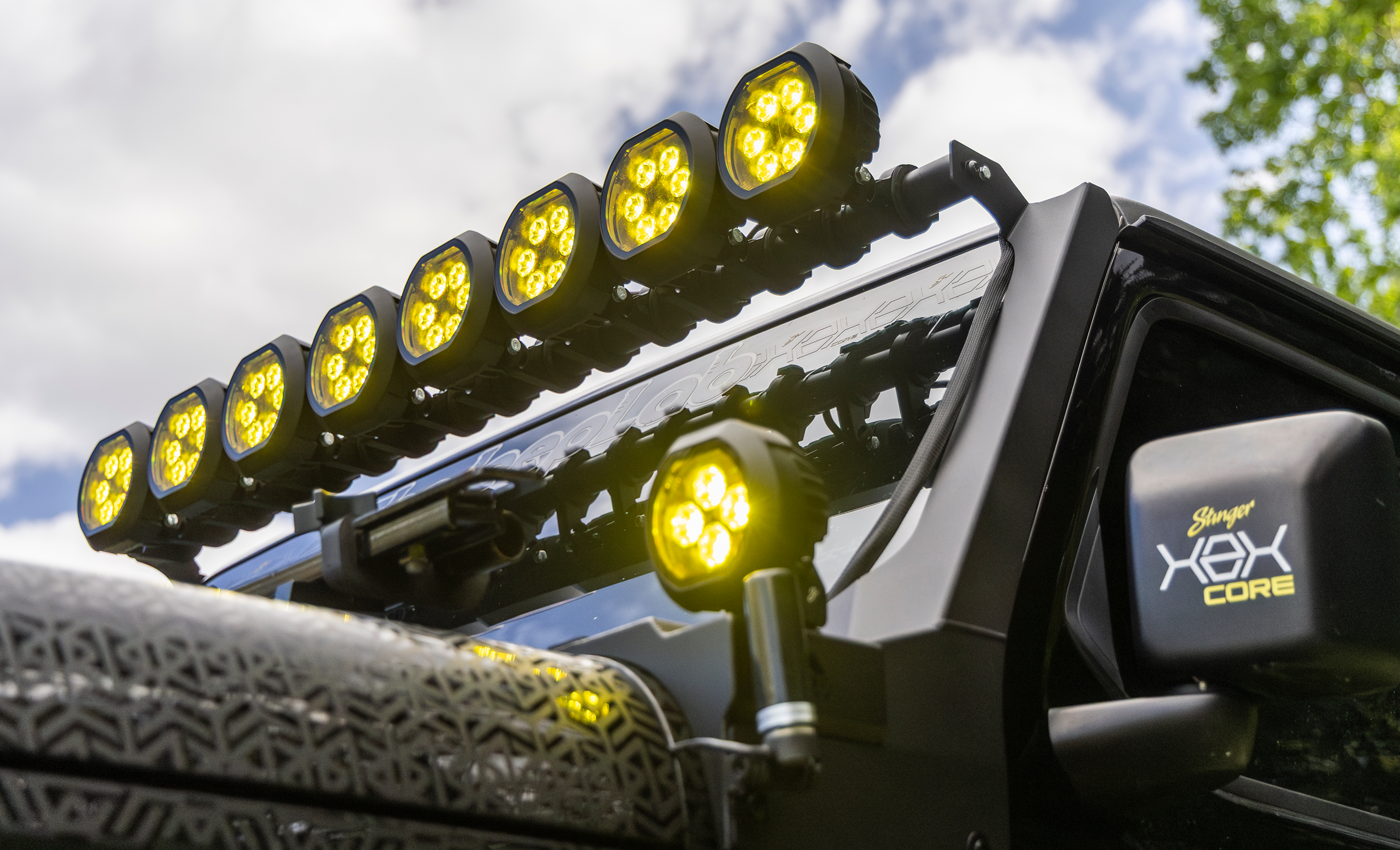 Roof-mounted light bar on a vehicle with a clear sky background