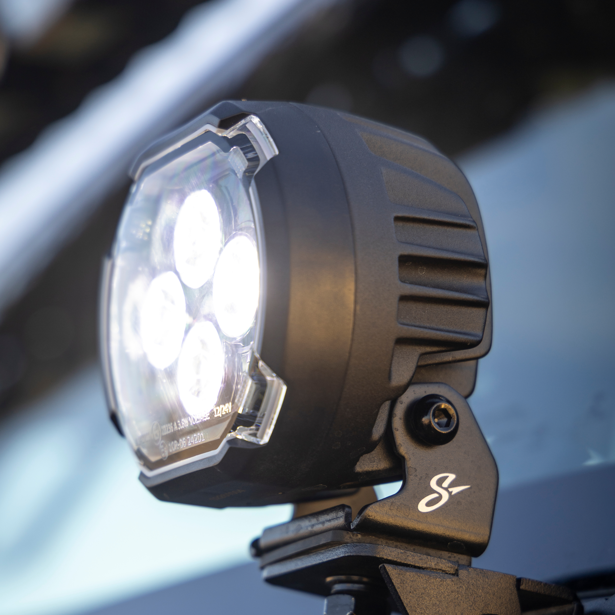 Close-up of a motorcycle light with a blurred background