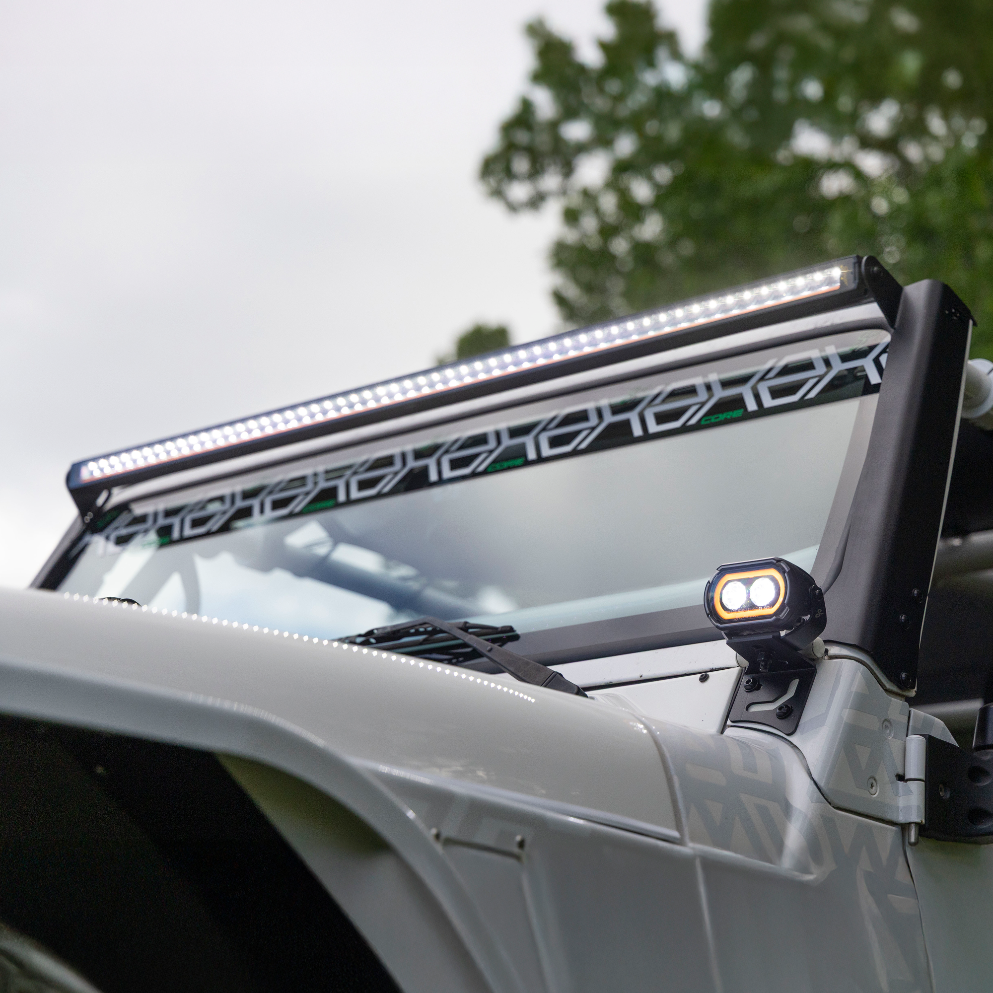 LED light bar on a vehicle with trees in the background