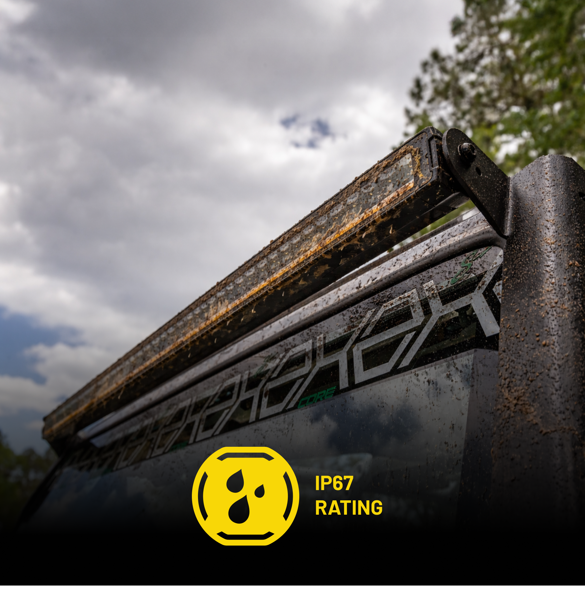 Roof rack light bar with IP67 rating label against a cloudy sky