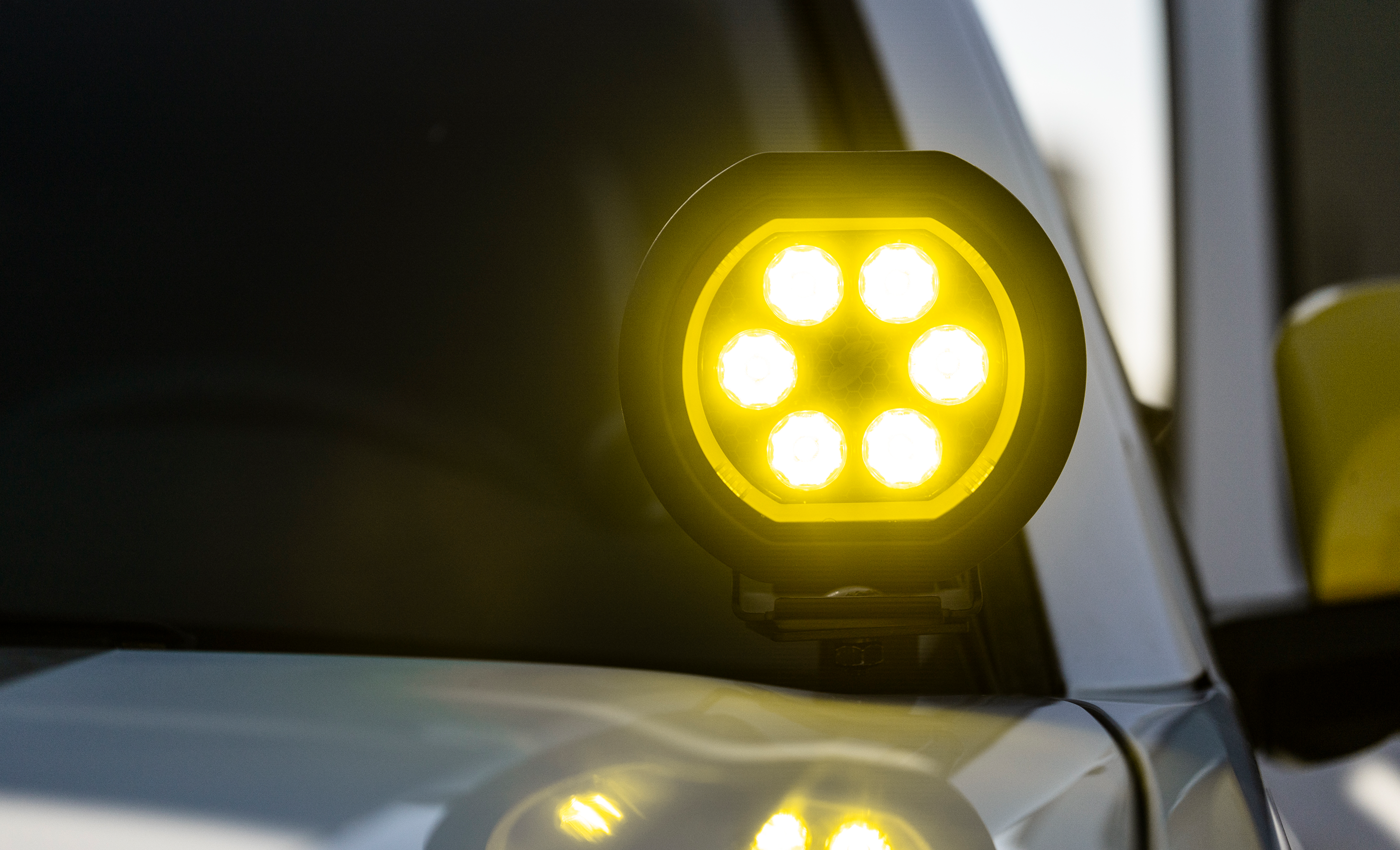 Yellow LED light on a vehicle in a dark setting
