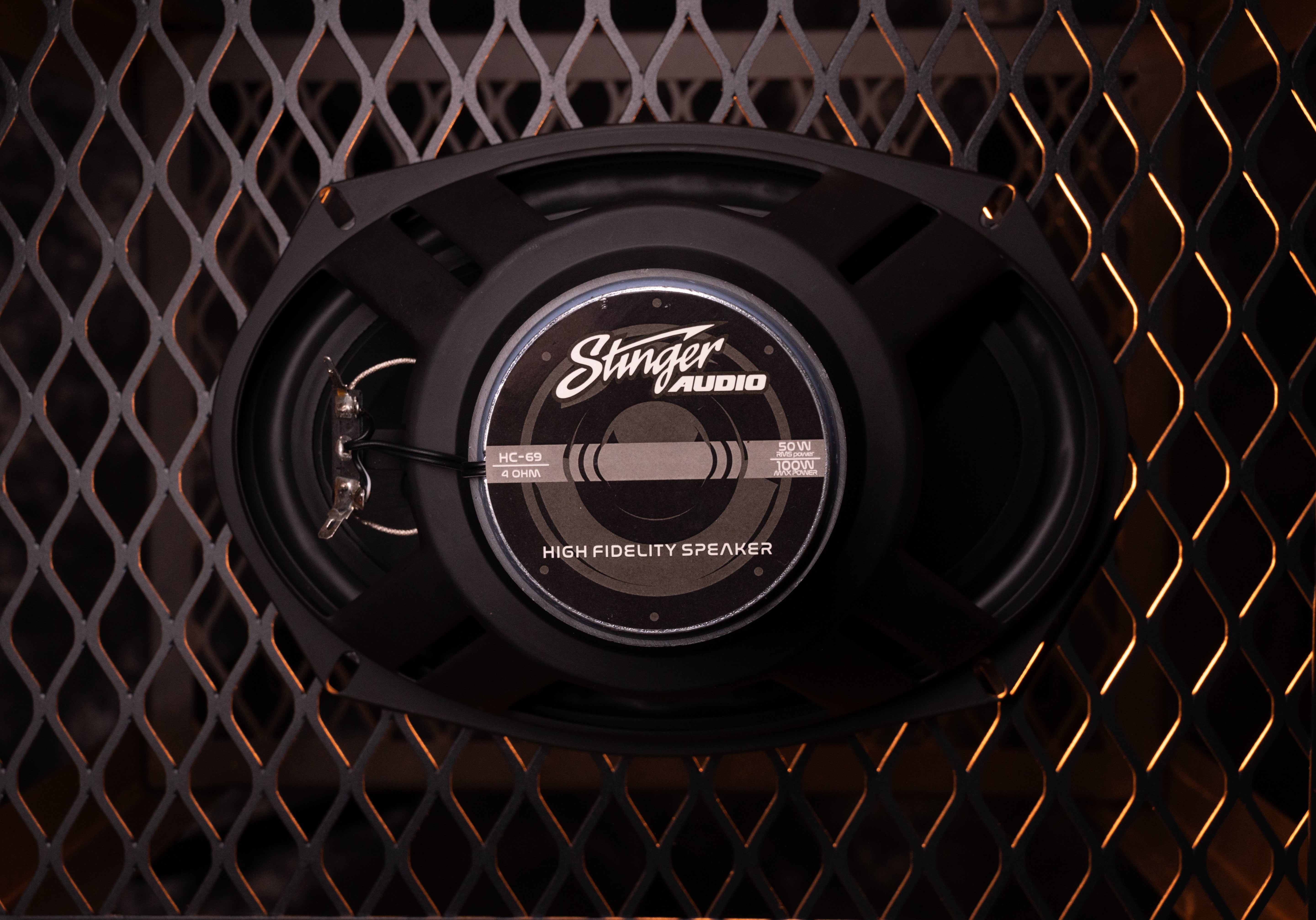 Hero image of the back of the speaker, reading "Stinger Audio, HC-69/4 OHM, 50 watt RMS power/100 watt Max power, High Fidelity Speaker"