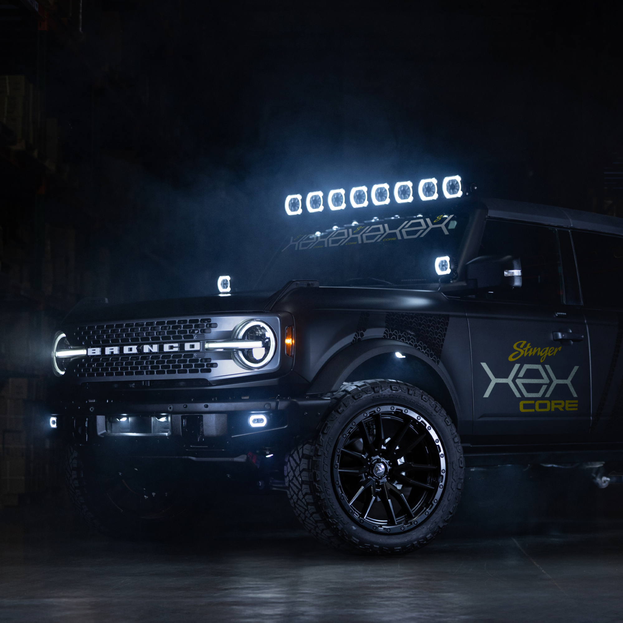 Black Ford Bronco with Stinger Hex Core branding and roof mounted LED light bar