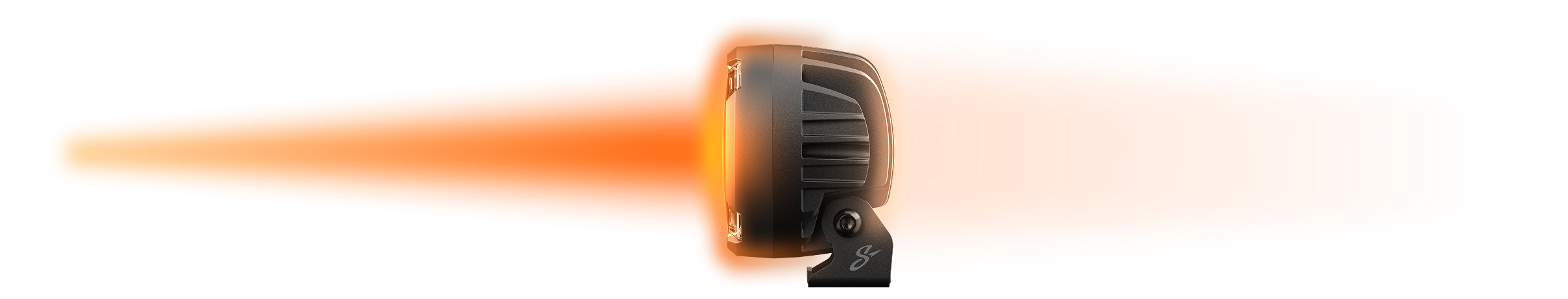 Round black LED off road light emitting a bright orange beam