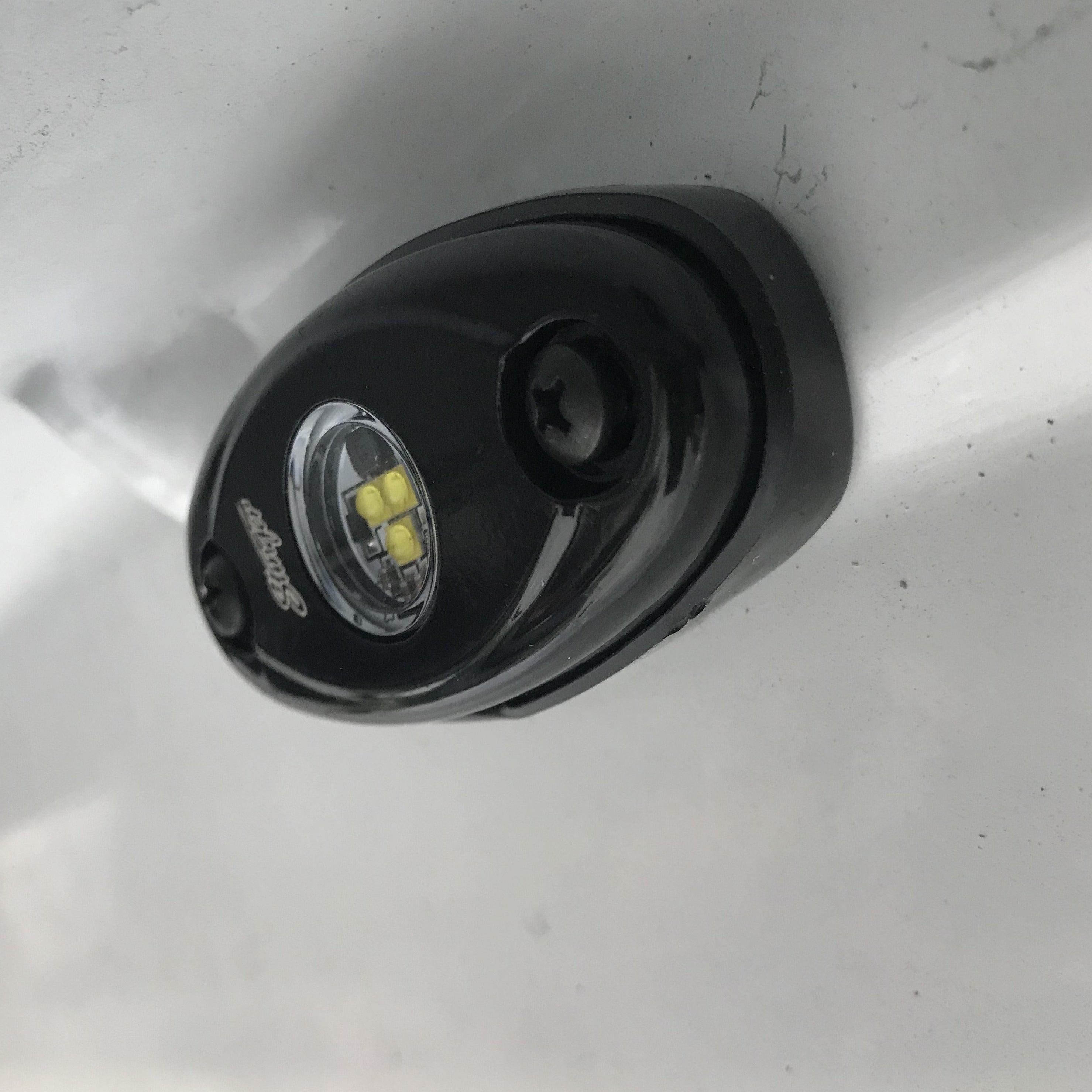 Close up of one Stinger LED Rock Light Module turned off