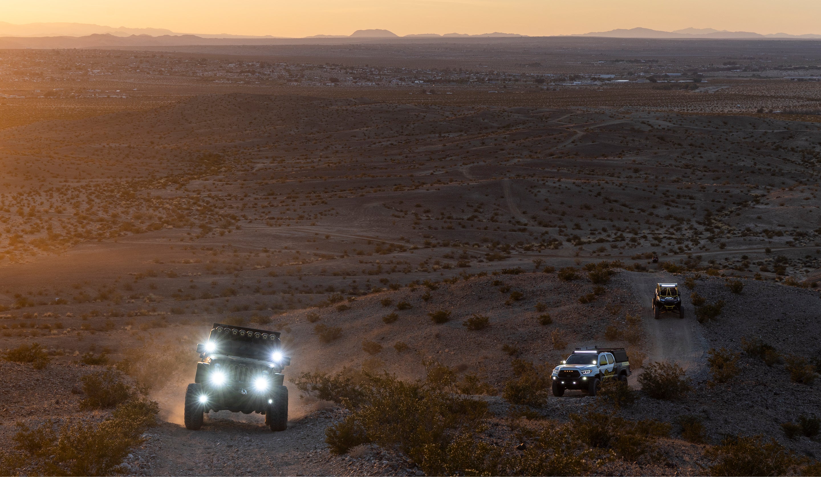 vehicles off-roading in the desert