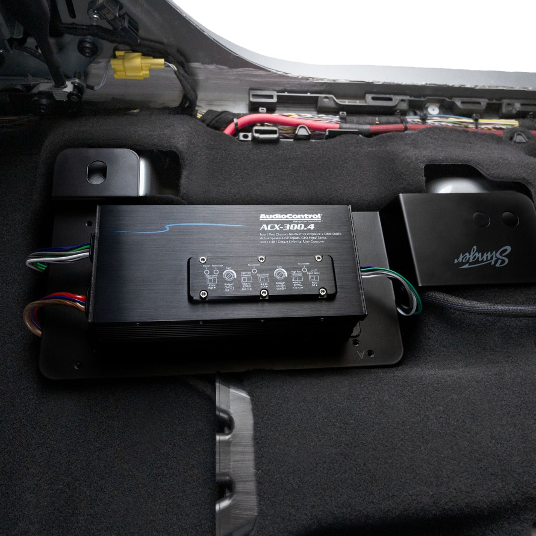 AudioControl ACX-300.4 amplifier mounted in a vehicle interior