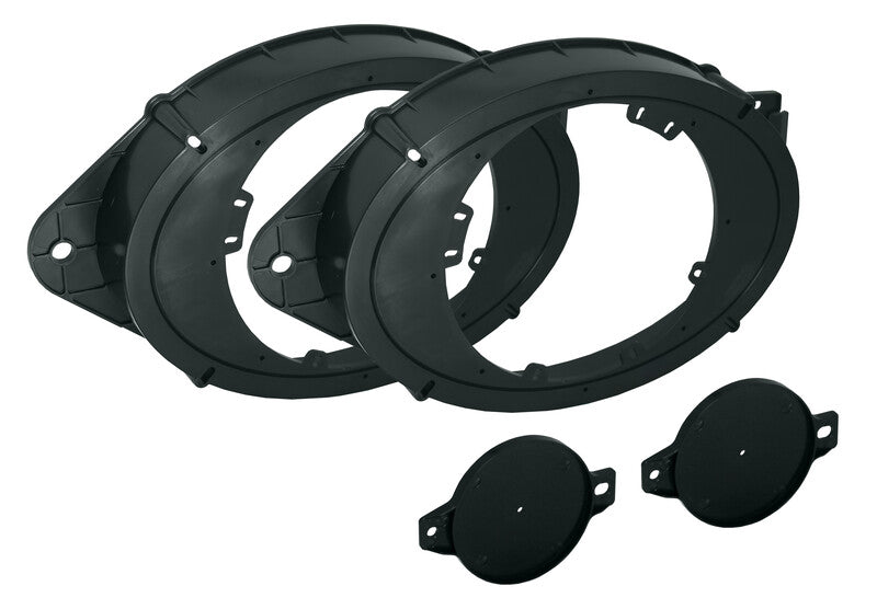 Two black plastic oval speaker adapter rings and two small circular covers